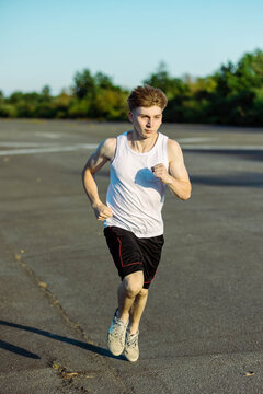 Teeange Boy In A Sleeveless Top And Shorts