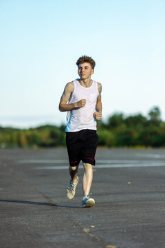 Teeange Boy In A Sleeveless Top And Shorts