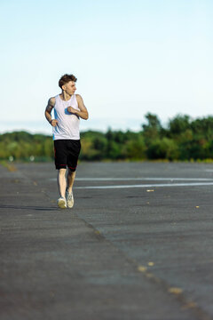 Teeange Boy In A Sleeveless Top And Shorts