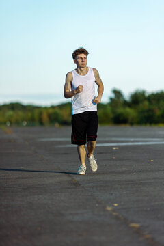 Teeange Boy In A Sleeveless Top And Shorts