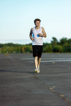 Teeange Boy In A Sleeveless Top And Shorts
