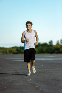 Teeange Boy In A Sleeveless Top And Shorts