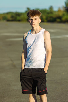 Teeange Boy In A Sleeveless Top And Shorts