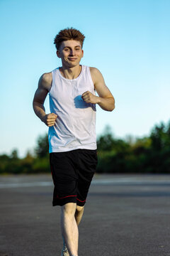 Teeange Boy In A Sleeveless Top And Shorts