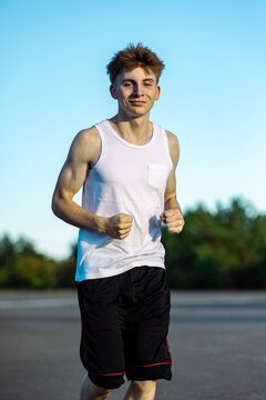 Teeange Boy In A Sleeveless Top And Shorts