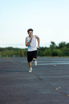 Teeange Boy In A Sleeveless Top And Shorts