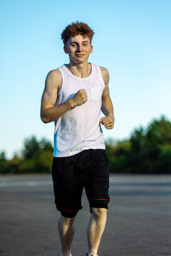 Teeange Boy In A Sleeveless Top And Shorts