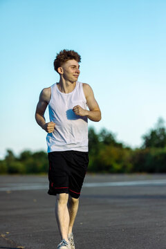 Teeange Boy In A Sleeveless Top And Shorts