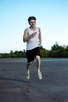 Teeange Boy In A Sleeveless Top And Shorts