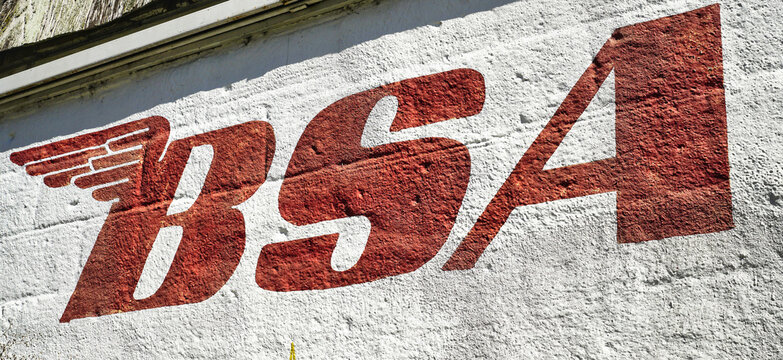 Logo for BSA motorcycles on a block building, USA 2026