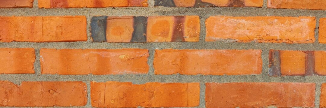 Rough red brick wall texture presenting full frame close up background
