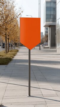 Blank Orange Directional Sign on City Sidewalk