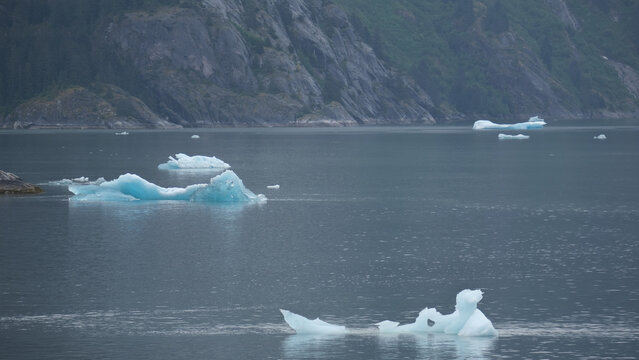 Breathtaking Alaska mountain glacier range view seen from outdoor deck of cruise ship liner sailing the Inside Passage transit with spectacular landscape wilderness scenery
