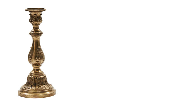 Ornate antique brass candlestick holder with intricate floral engravings and a wide circular base isolated on a transparent background