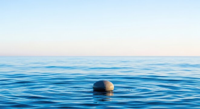 A peaceful minimalist scene featuring the expansive ocean horizon meeting a pale cloudless sky, capturing a sense of profound global calm, quiet, panoramic, water