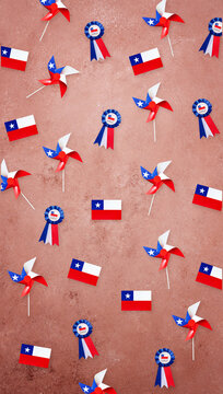 Chilean flags, pinwheels, and cockades creating a festive background for fiestas patrias