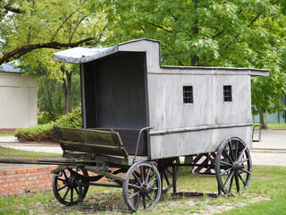 Gray wooden wagon and black wheels © andsyphoto