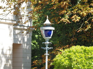 Blue glass in a street lamp © andsyphoto