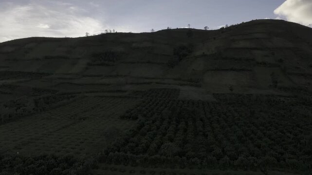 Aerial drone view of Chu Dang Ya Volcano at sunset in Bien Ho, Gia Lai, Vietnam, revealing dramatic volcanic terrain, lush highlands and a stunning golden sky.
