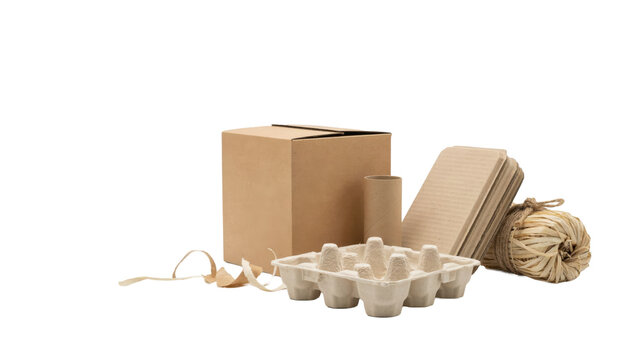 Cardboard box, molded pulp egg tray, paper tube, and raffia twine bundle isolated on a transparent background