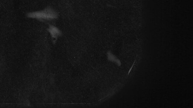Fast rewind of extreme close-up vintage x-ray radiograph scan textures. Seamless looping grunge film overlay with dust, scratches and noise.