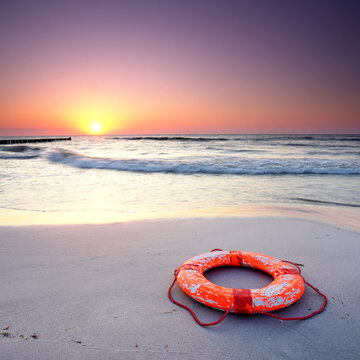 Rescue Ring on a Baltic Sea Beach at Sunset