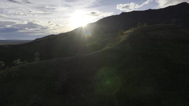Aerial drone view of Chu Dang Ya Volcano at sunset in Bien Ho, Gia Lai, Vietnam, revealing dramatic volcanic terrain, lush highlands and a stunning golden sky.