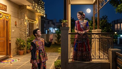 Fototapeta premium Gujarati Boy and Girl Under Full Moon During Garba Festival 