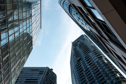 Summer in Frankfurt am Main, skyscrapers, office and residential buildings against a blue sky. Tall buildings, modern architecture, building exterior, travel destinations.