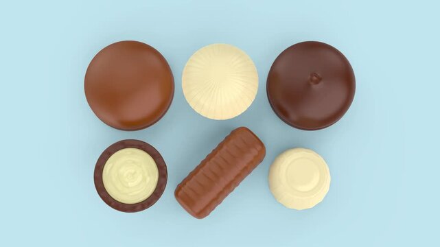 Assorted chocolate candies on light blue background