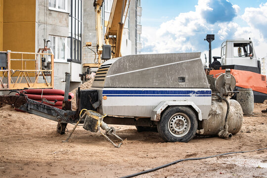 Construction site features heavy equipment and machinery on a sunny day