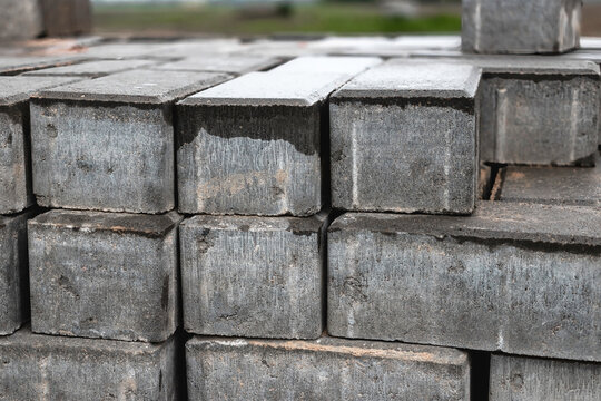 Cinder blocks stacked for construction in a building site during midday