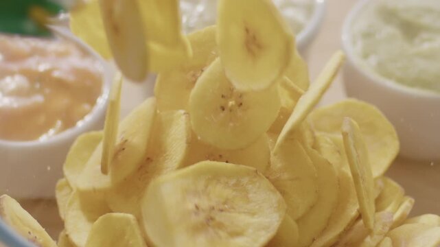 Slow Motion Video of Plantain Chips Falling into a Bowl - Dynamic Snack Footage