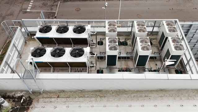 Aerial view of industrial HVAC cooling units installed on a flat rooftop in Riga, Latvia.