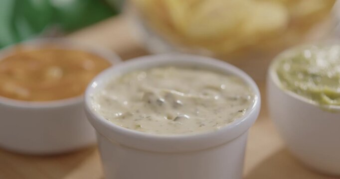 Plantain Chips Dipping into Sauce - Appetizing Snack Video
