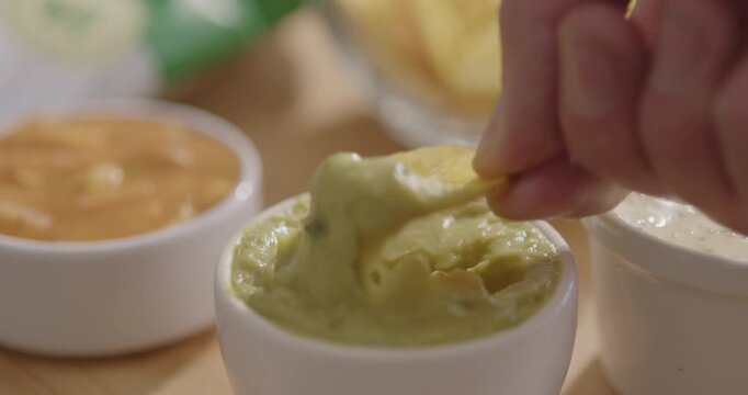 Plantain Chips Dipping into Sauce - Appetizing Snack Video