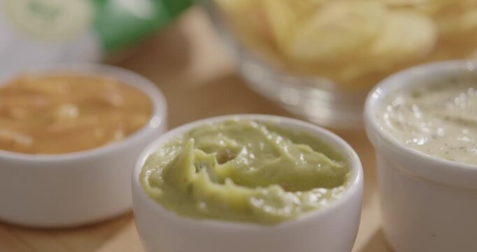 Plantain Chips Dipping into Sauce - Appetizing Snack Video