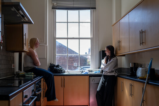 Gen Z girls in the kitchen of their shared house,.