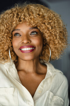 Happy Black Woman In Close Up Looking Away