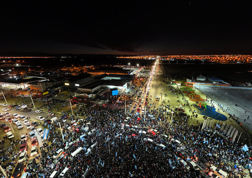 Crowd Gathers on a Busy Street for a Night Event in the City