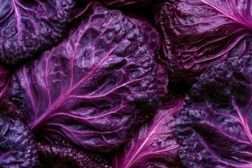 Obraz premium Close-up view of purple cabbage leaves stacked together in a market setting