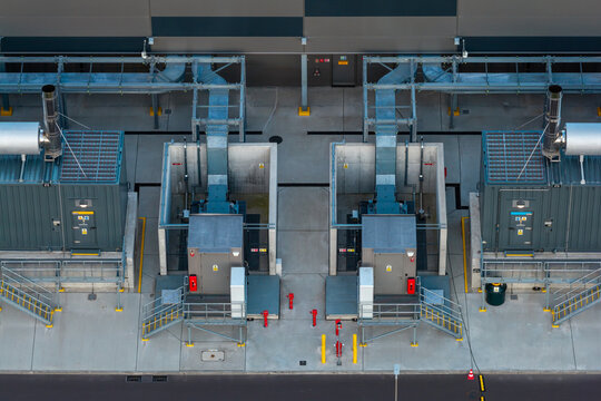 Aerial view of backup diesel generators and fire barriers at data center.