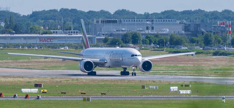 Germany - Hamburg, June 19, 2026: An Emirates Boeing 777 taxis at Hamburg Airport, clearly showcasing the airline&rsquo;s brand whilst airport operations continue as normal