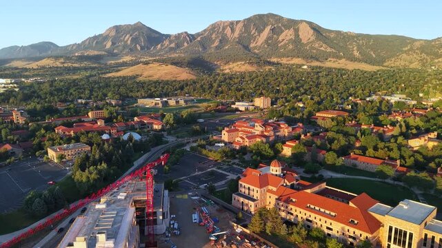 Drone view backing up of the University of Colorado Boulder and the Flatirons