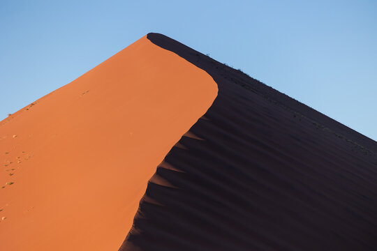 Namib Desert red sand dune contrasting light and shadow