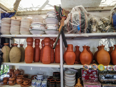 Handmade Clay Pottery and Traditional Ceramic Kitchenware on Display at a Local Market
