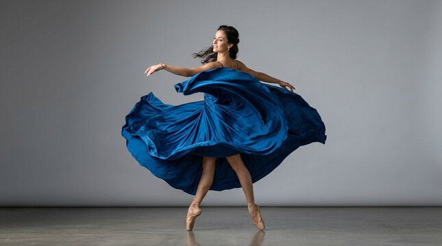 Graceful Ballerina Spinning in Elegant Blue Dress