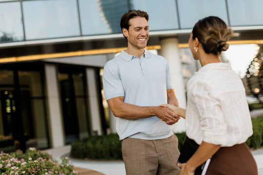 Joyful meeting between friends in a vibrant outdoor setting