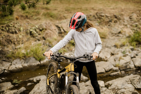 Exploring rocky paths with mountain bike adventure in nature's embrace