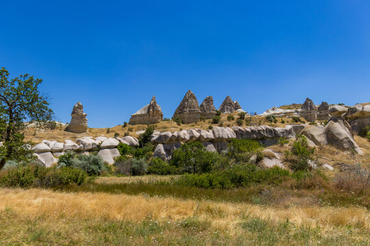 Close-up of fairy chimneys in Love Valley Cappadocia. Concept of geological heritage, natural wonder, travel destination and outdoor exploration. 